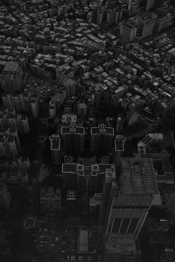 Black and white aerial view of a dense city block